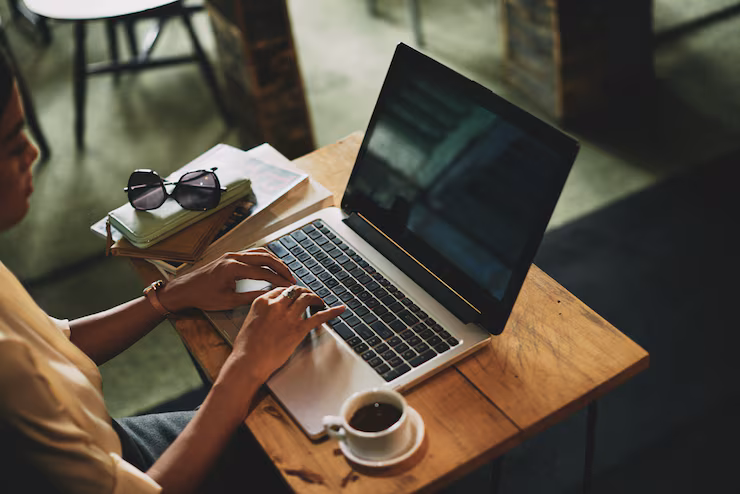 Freelancer working on a laptop in a café